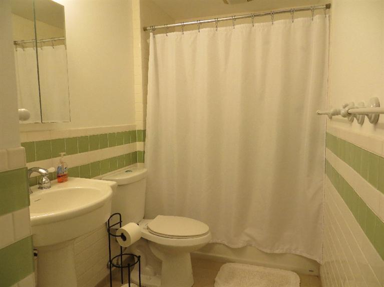 230 Salt Works Road Eastham, MA 02642 - Photo 15 of 35 a bathroom with a sink a toilet and shower curtain