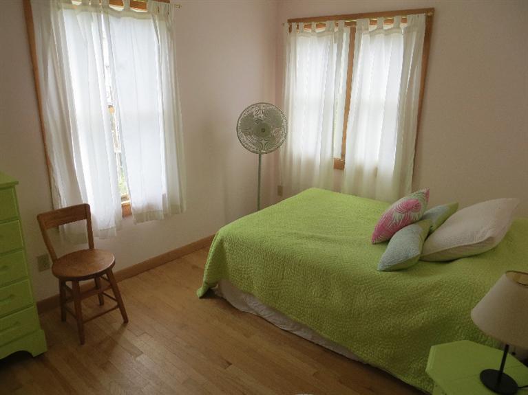 230 Salt Works Road Eastham, MA 02642 - Photo 18 of 35 a bedroom with a bed and a window