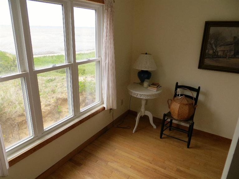 230 Salt Works Road Eastham, MA 02642 - Photo 19 of 35 a view of a workspace with furniture and a window