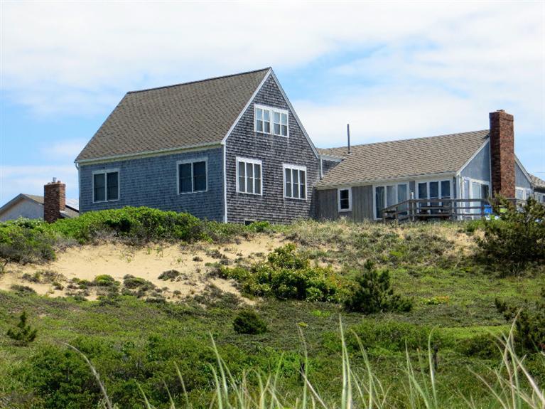 230 Salt Works Road Eastham, MA 02642 - Photo 21 of 35 a front view of a house with a garden