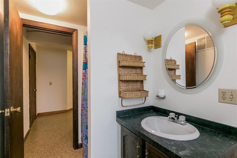 230 Salt Works Road Eastham, MA 02642 - Photo 30 of 35 a bathroom with a sink and a mirror