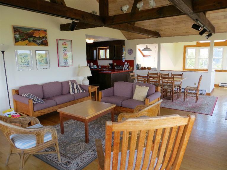 230 Salt Works Road Eastham, MA 02642 - Photo 3 of 35 a living room with furniture kitchen view and a large window