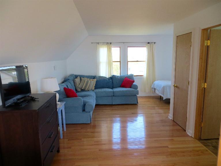 230 Salt Works Road Eastham, MA 02642 - Photo 7 of 35 a living room with furniture and a flat screen tv