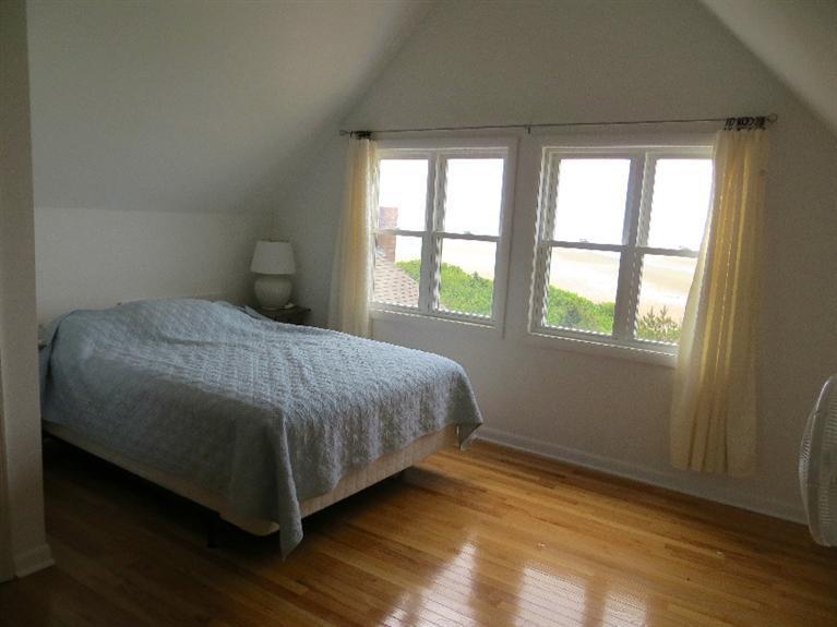 230 Salt Works Road Eastham, MA 02642 - Photo 8 of 35 a bedroom with a bed and a window