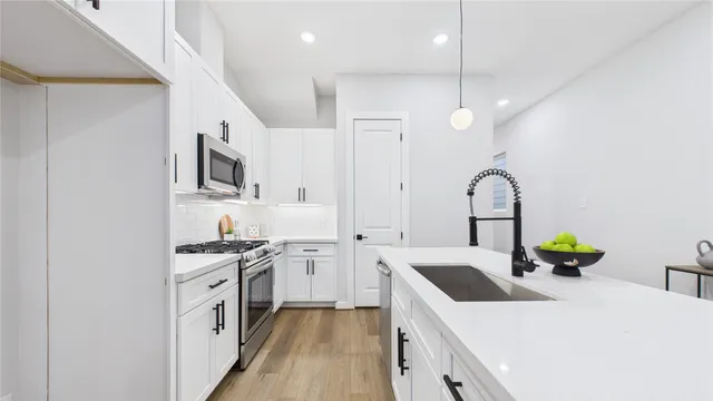 a living room with furniture a table and a painting