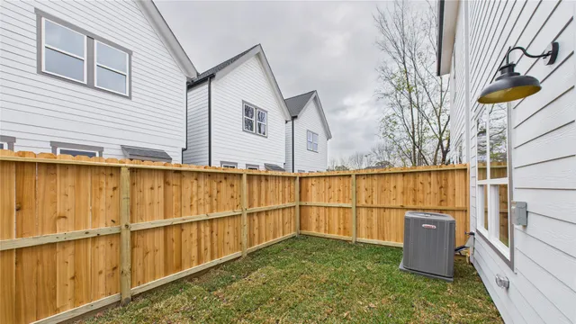 a bathroom with a granite countertop sink a toilet and a bathtub