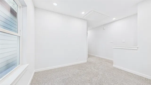 a bed room with a bed and a window