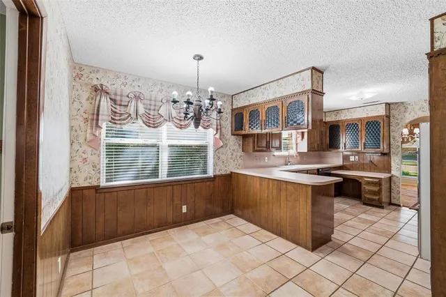 a kitchen with stainless steel appliances a stove and cabinets
