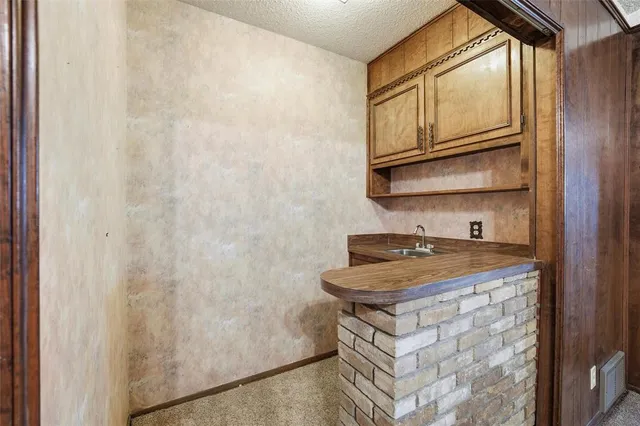 a kitchen with stainless steel appliances granite countertop a stove and a microwave