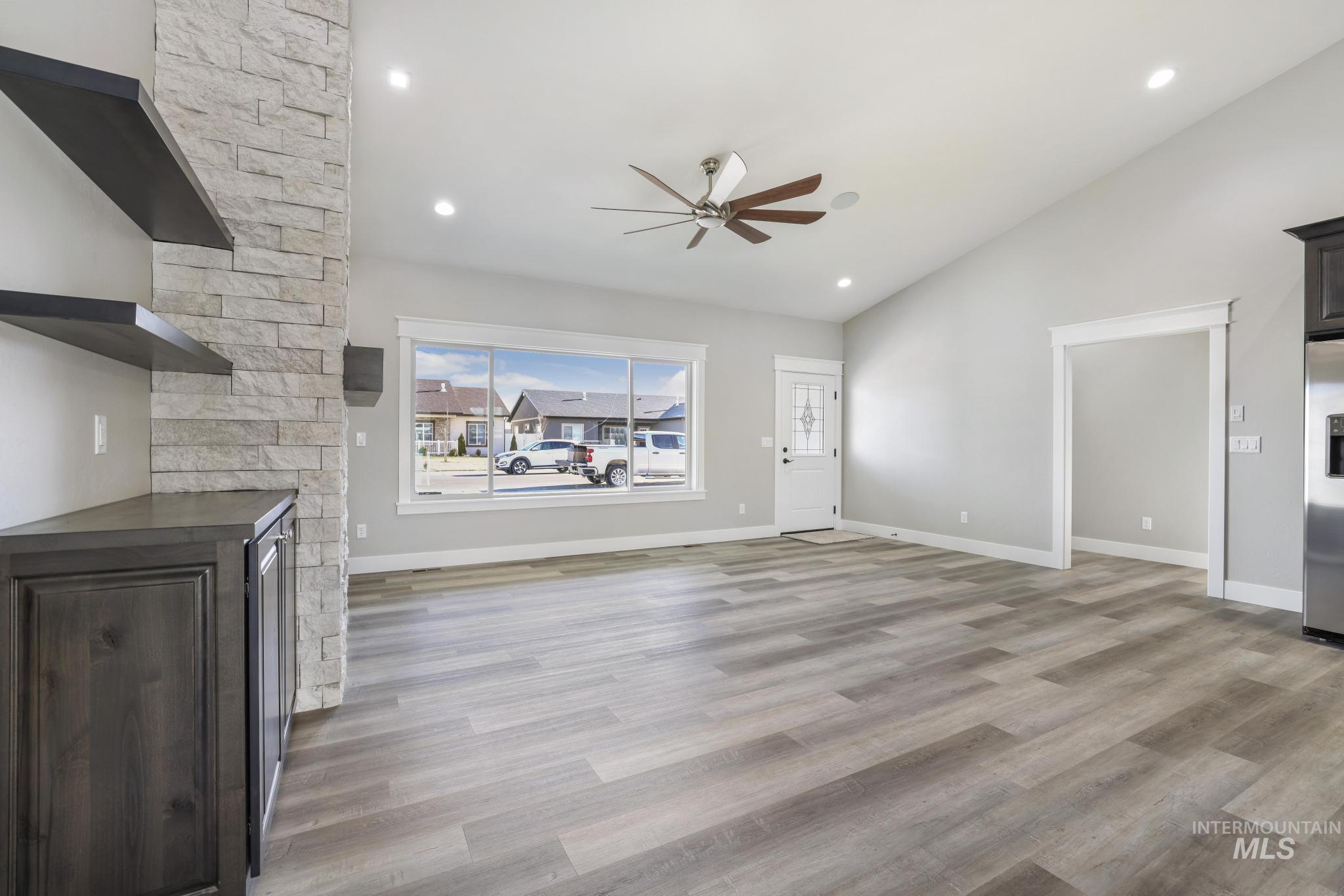 298 Sandi Road Twin Falls, ID 83301 - Photo 20 of 24 Spacious living area featuring wood-finish flooring, vaulted ceilings, and recessed lighting