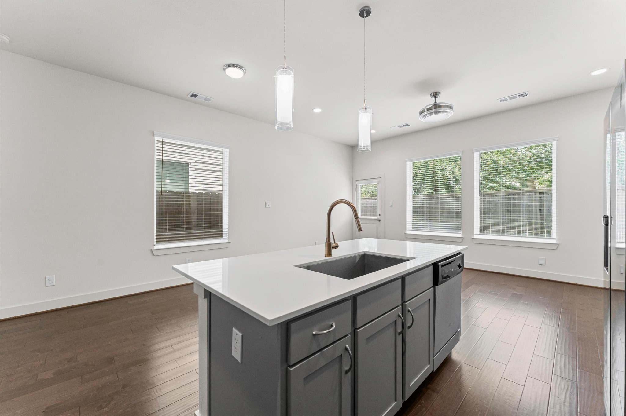 4163 Griggs Road Houston, TX 77021 - Photo 9 of 20 Kitchen island offers additional prep space and opens directly into the main living area.