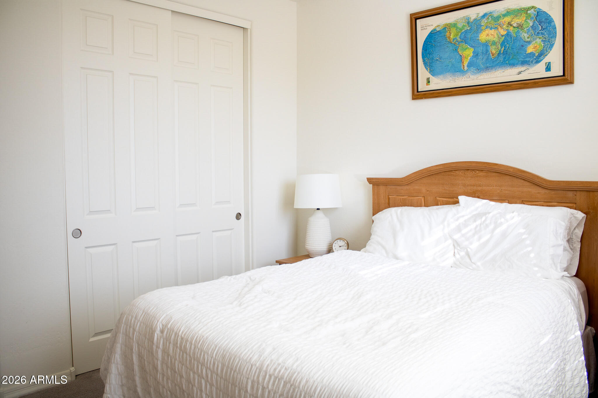 20378 West Maiden Lane Buckeye, AZ 85396 - Photo 11 of 41 a bedroom with a bed and cupboard