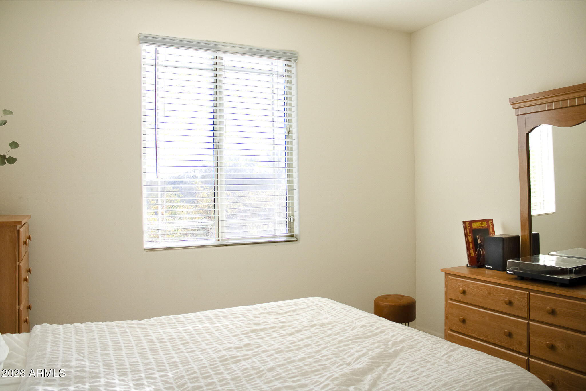 20378 West Maiden Lane Buckeye, AZ 85396 - Photo 12 of 41 a bedroom with a bed and a window