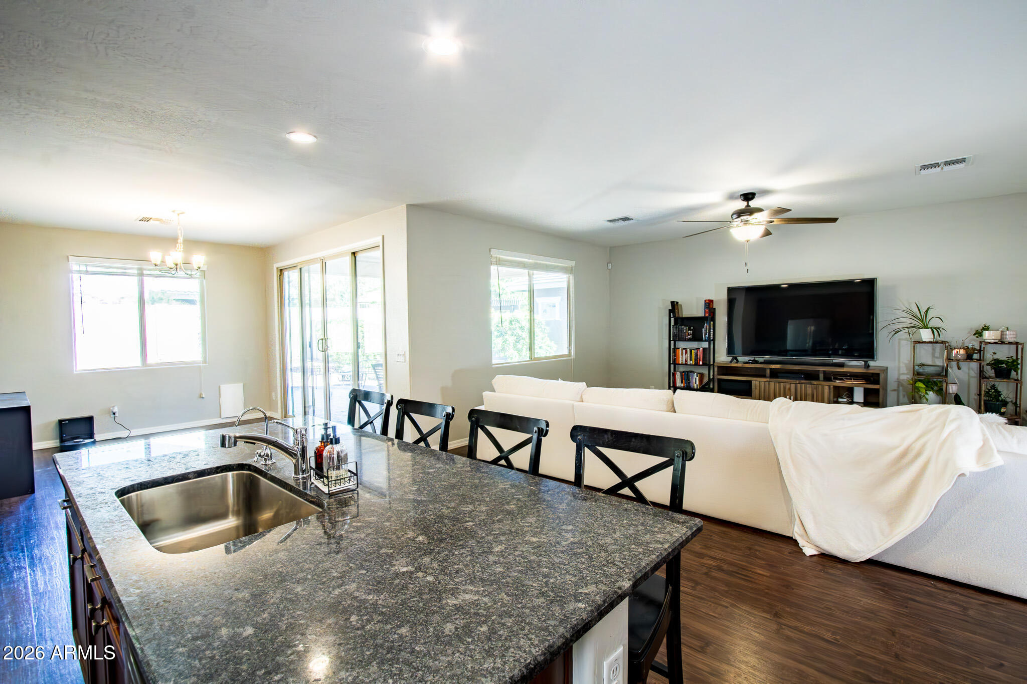 20378 West Maiden Lane Buckeye, AZ 85396 - Photo 19 of 41 a living room with furniture and a flat screen tv