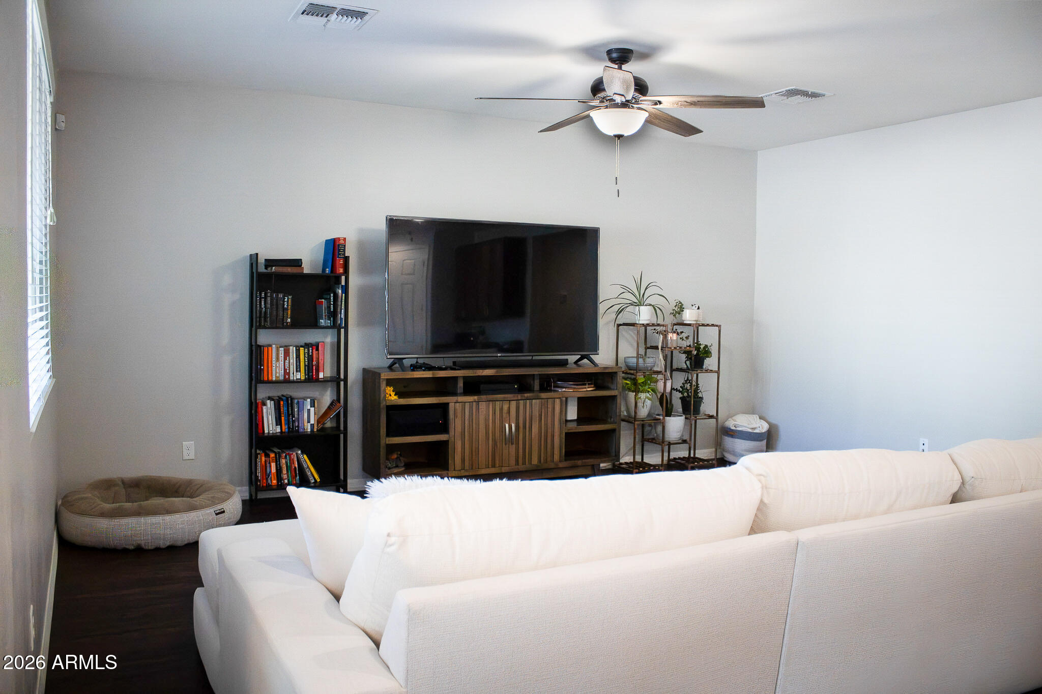 20378 West Maiden Lane Buckeye, AZ 85396 - Photo 21 of 41 a living room with furniture a ceiling fan and a window