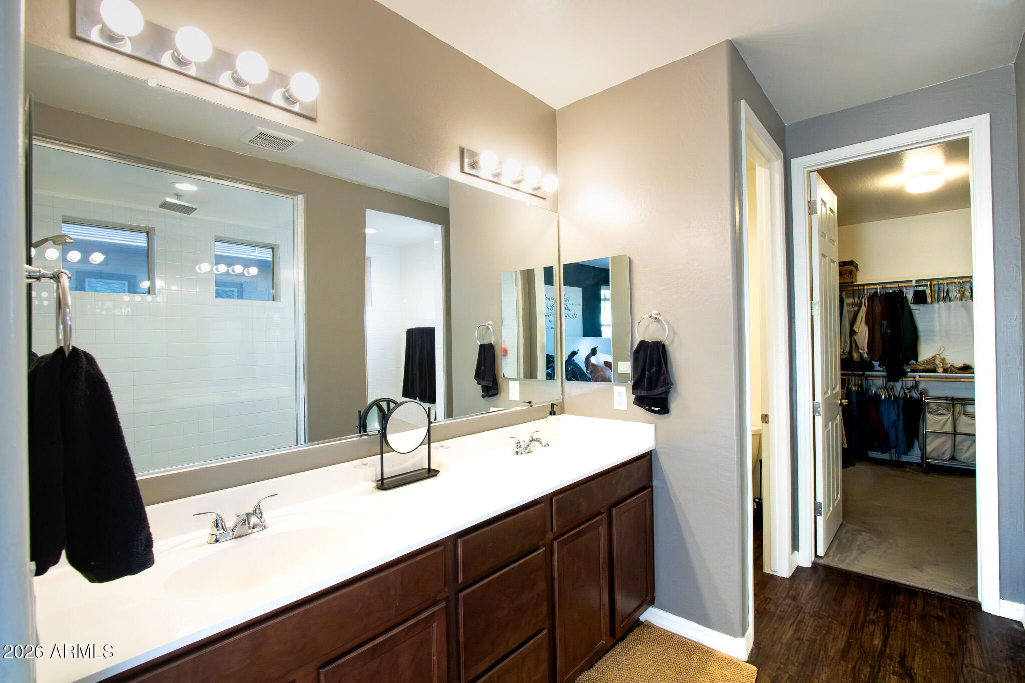 20378 West Maiden Lane Buckeye, AZ 85396 - Photo 27 of 41 a en suite bathroom with double sink and mirror