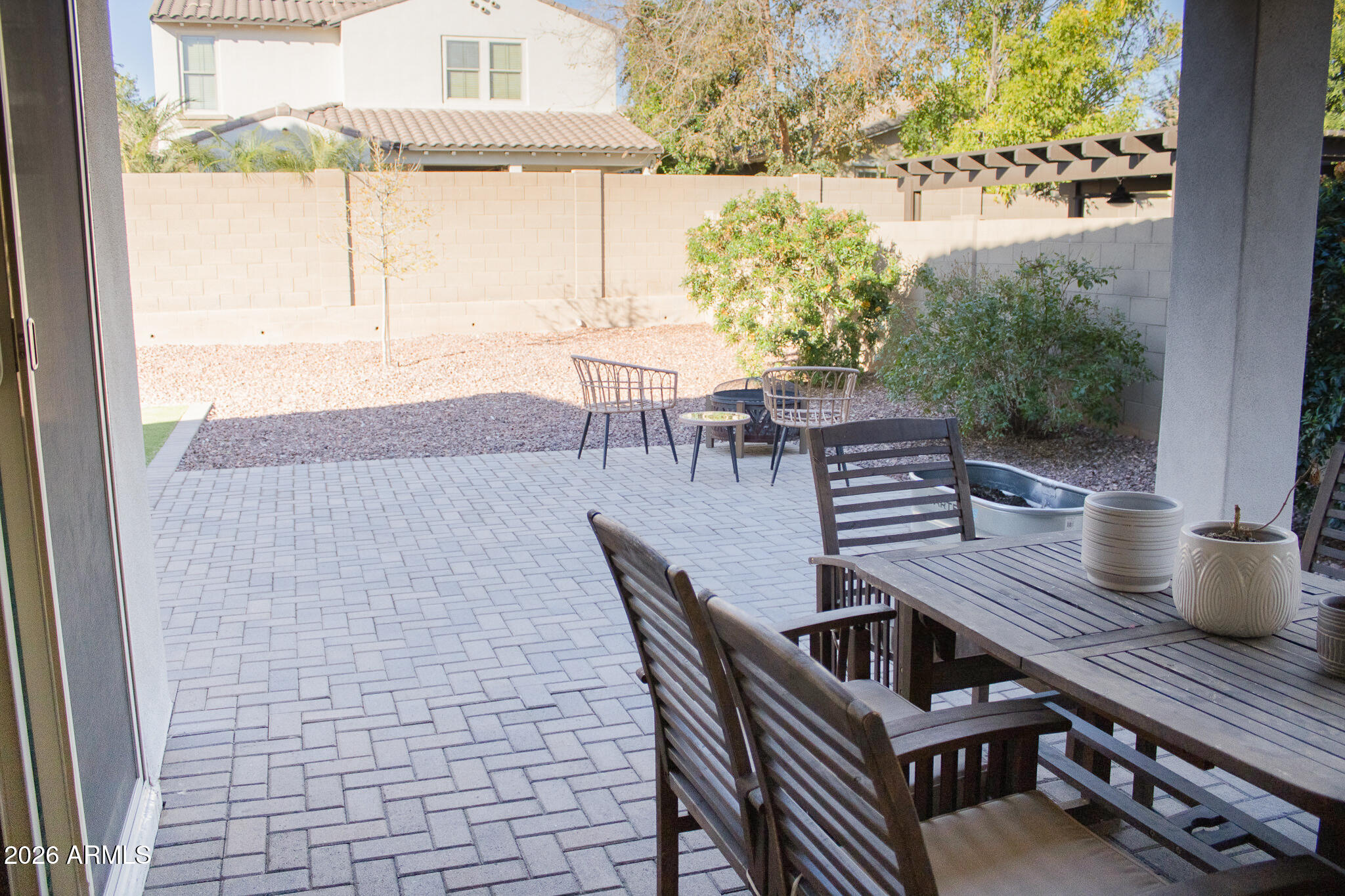 20378 West Maiden Lane Buckeye, AZ 85396 - Photo 30 of 41 a view of a patio with table and chairs and potted plants