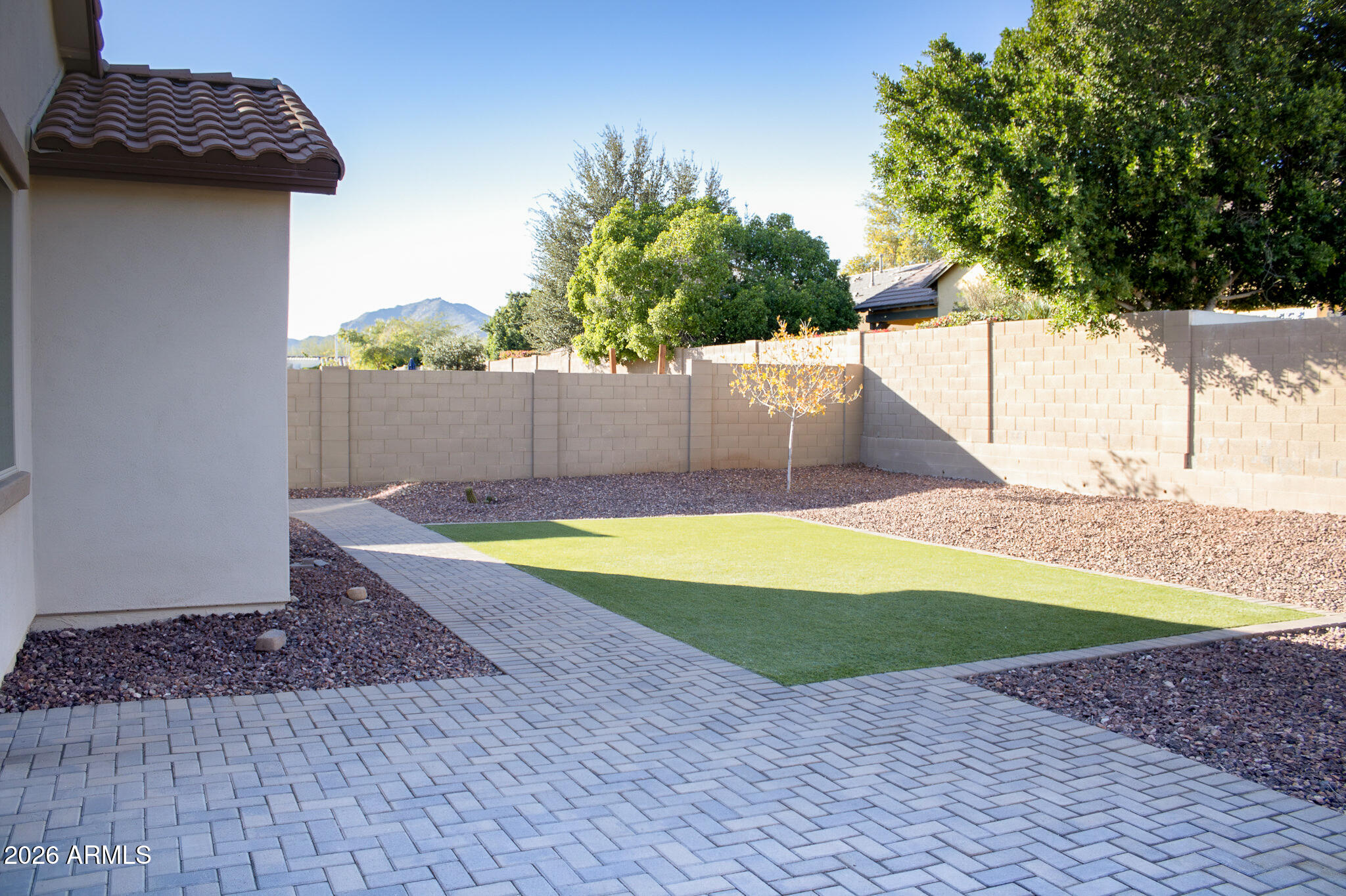 20378 West Maiden Lane Buckeye, AZ 85396 - Photo 31 of 41 a view of a backyard with plants and a lake view