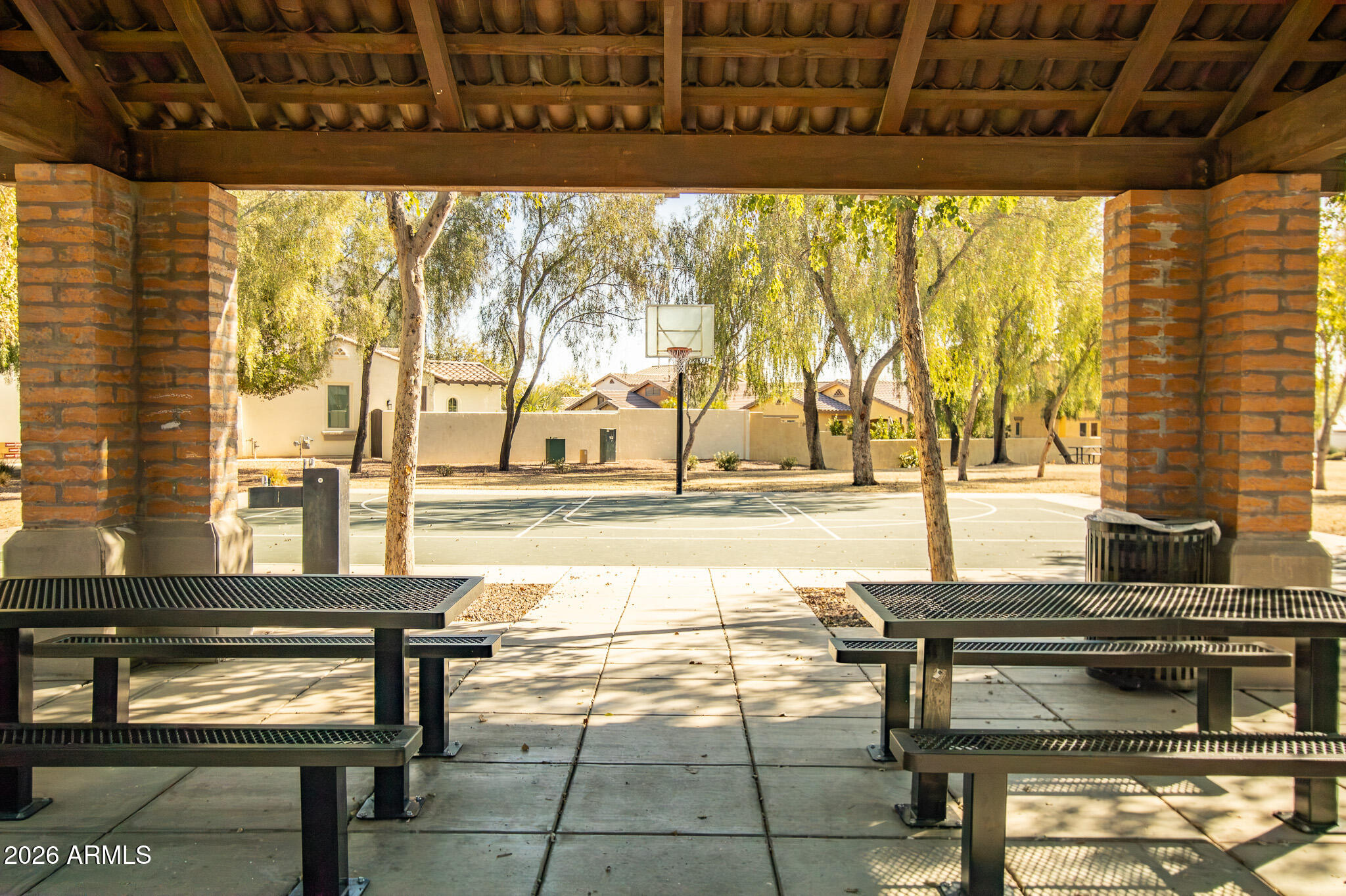 20378 West Maiden Lane Buckeye, AZ 85396 - Photo 40 of 41 a living room with a table and chair with a floor to ceiling window