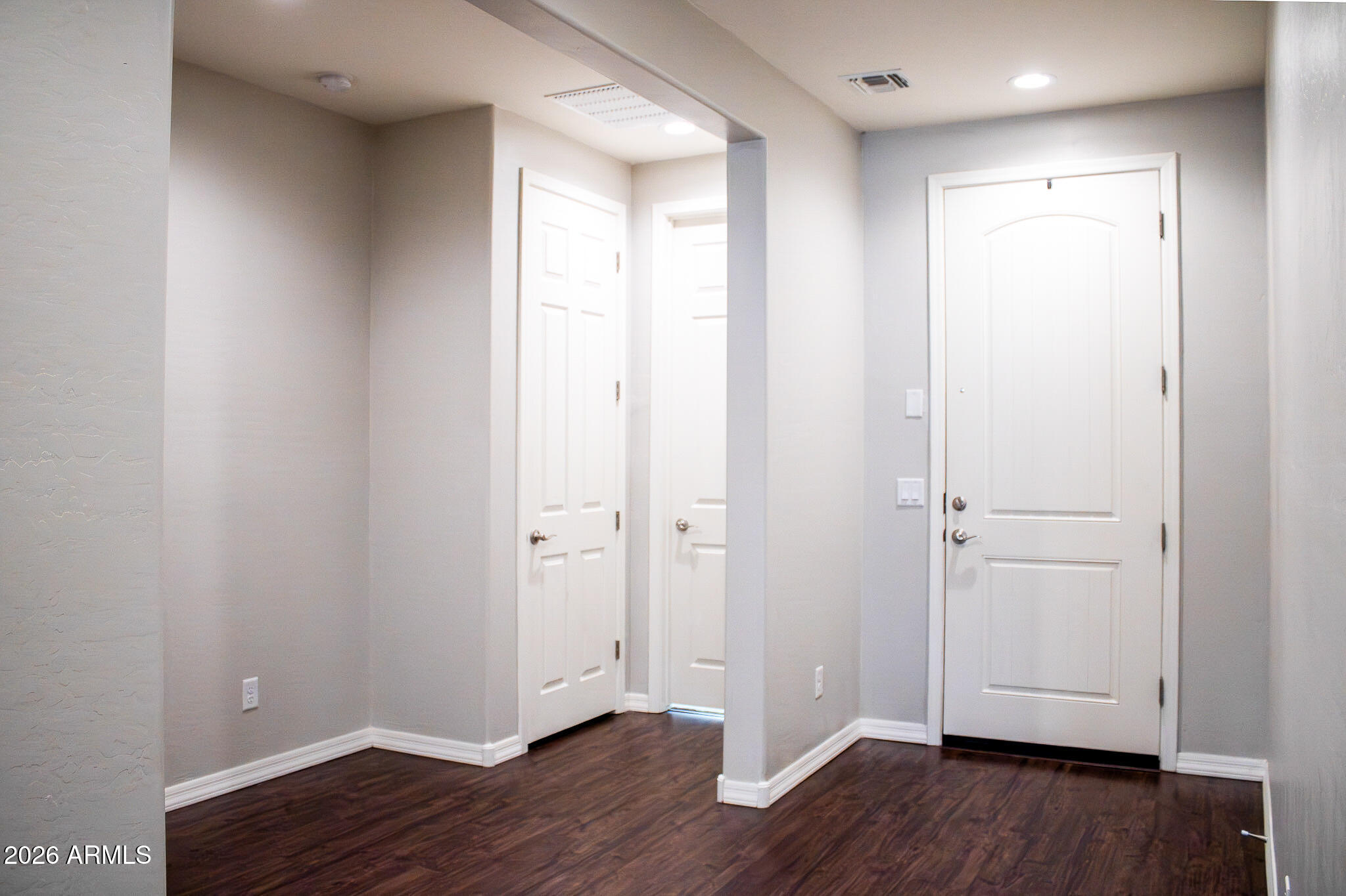 20378 West Maiden Lane Buckeye, AZ 85396 - Photo 8 of 41 a view of an empty room with wooden floor