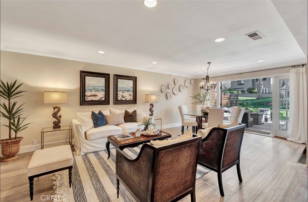507 Cancha Newport Beach, CA 92660 - Photo 12 of 39 a living room with furniture and wooden floor