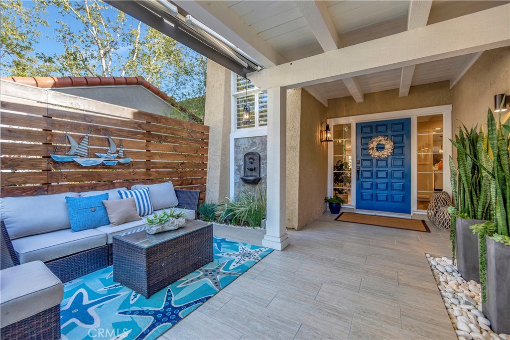 507 Cancha Newport Beach, CA 92660 - Photo 2 of 39 a view of a couches in the patio with potted plants