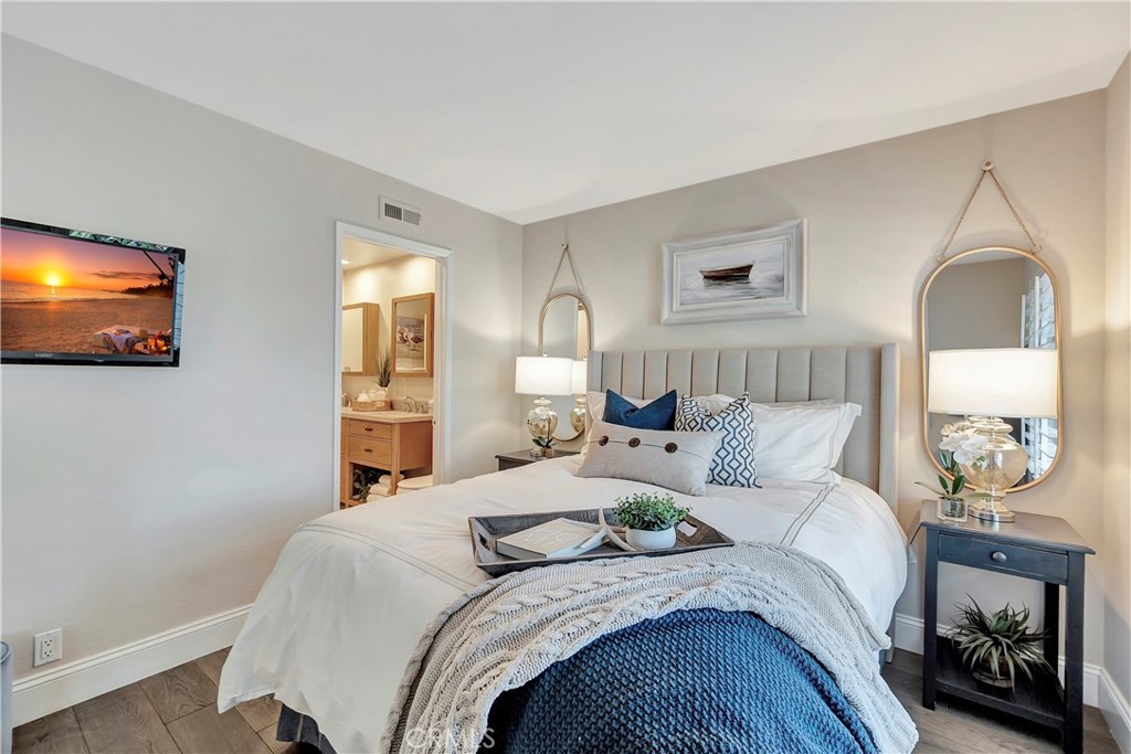 507 Cancha Newport Beach, CA 92660 - Photo 22 of 39 a bedroom with bed and a flat screen tv