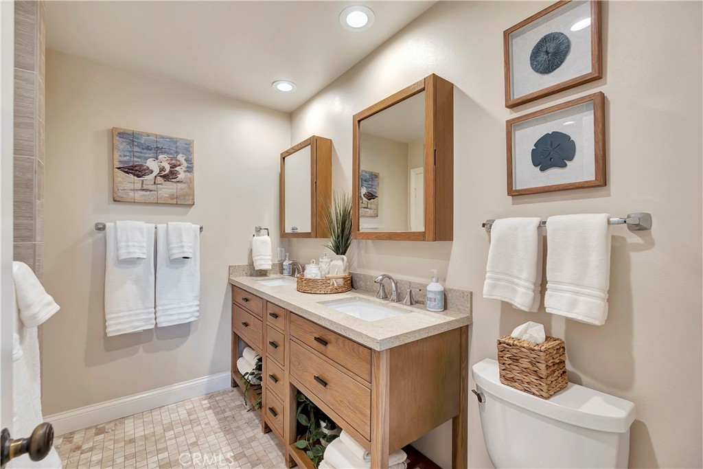 507 Cancha Newport Beach, CA 92660 - Photo 24 of 39 a bathroom with a sink and a mirror