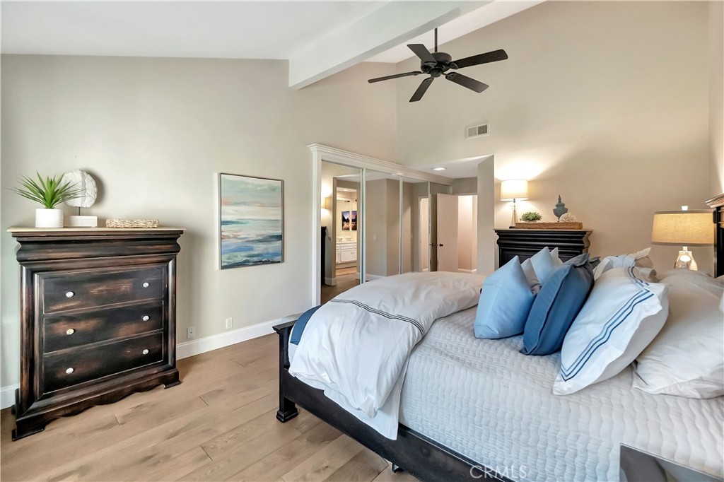507 Cancha Newport Beach, CA 92660 - Photo 30 of 39 a bedroom with a bed and a dresser
