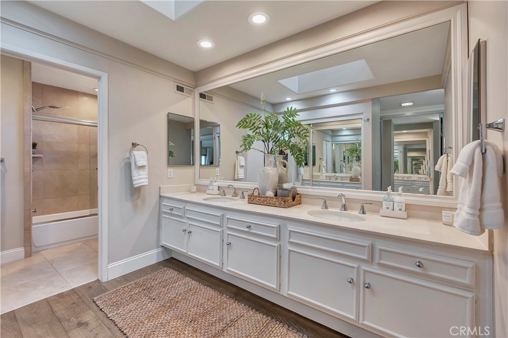 507 Cancha Newport Beach, CA 92660 - Photo 31 of 39 a bathroom with a double vanity sink and a mirror