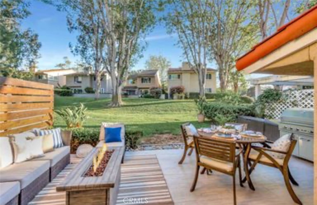 507 Cancha Newport Beach, CA 92660 - Photo 33 of 39 a view of a chairs and tables in the backyard