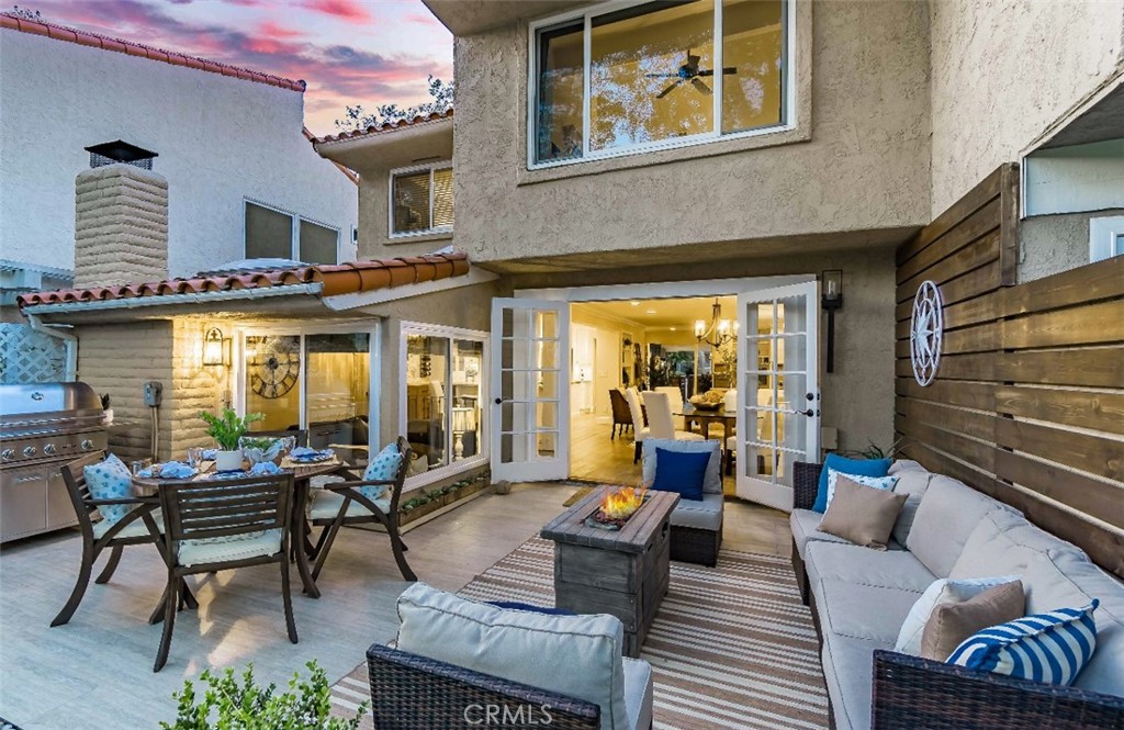 507 Cancha Newport Beach, CA 92660 - Photo 36 of 39 a outdoor living space with furniture and a potted plant