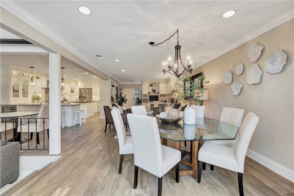507 Cancha Newport Beach, CA 92660 - Photo 8 of 39 a view of a dining room with furniture and wooden floor