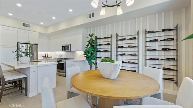 a living room with dining room and wooden floor