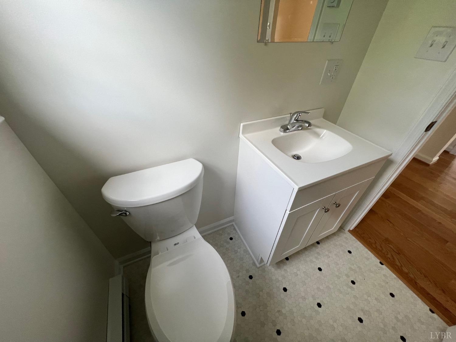 145 Church Street Amherst, VA 24521 - Photo 18 of 23 a bathroom with a sink and toilet
