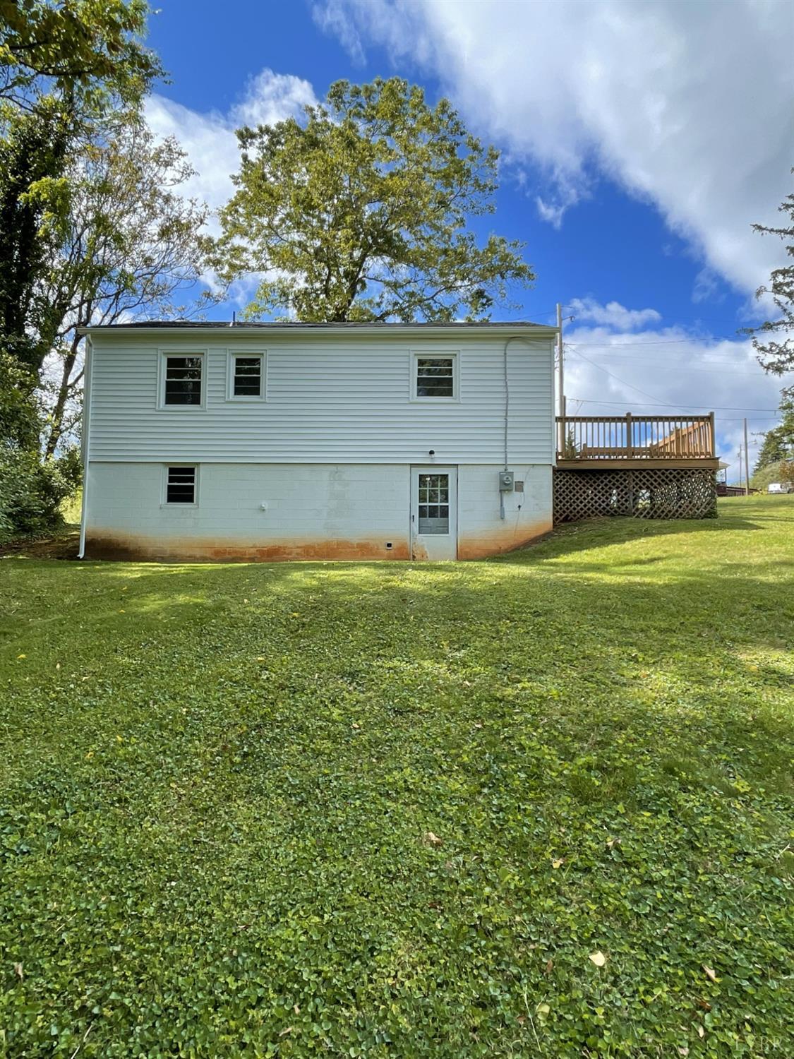 145 Church Street Amherst, VA 24521 - Photo 3 of 23 a view of a backyard with a garden and plants