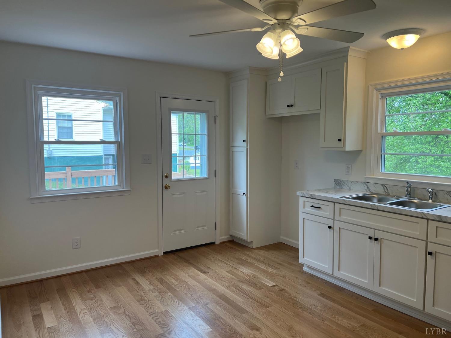 145 Church Street Amherst, VA 24521 - Photo 7 of 23 an empty room with closet and windows