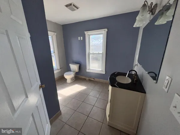 a bathroom with a sink and toilet