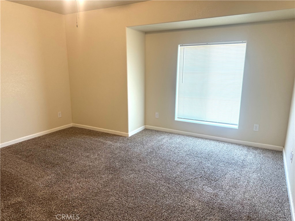 1339 Playa Del Rey Drive Merced, CA 95348 - Photo 21 of 48 an empty room with a window