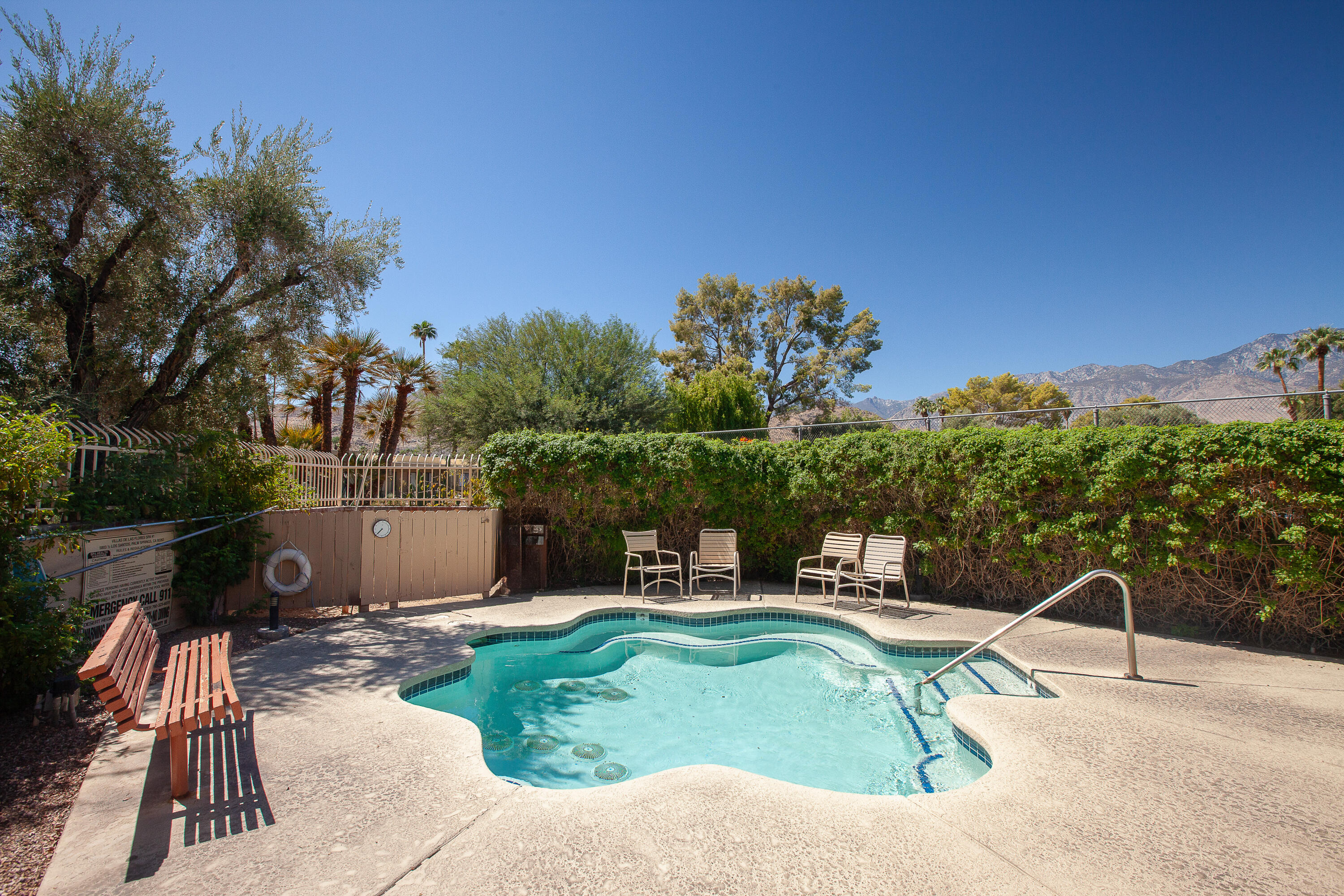 2348 Los Coyotes Drive Palm Springs, CA 92264 - Photo 11 of 15 a view of a chairs and table in the patio