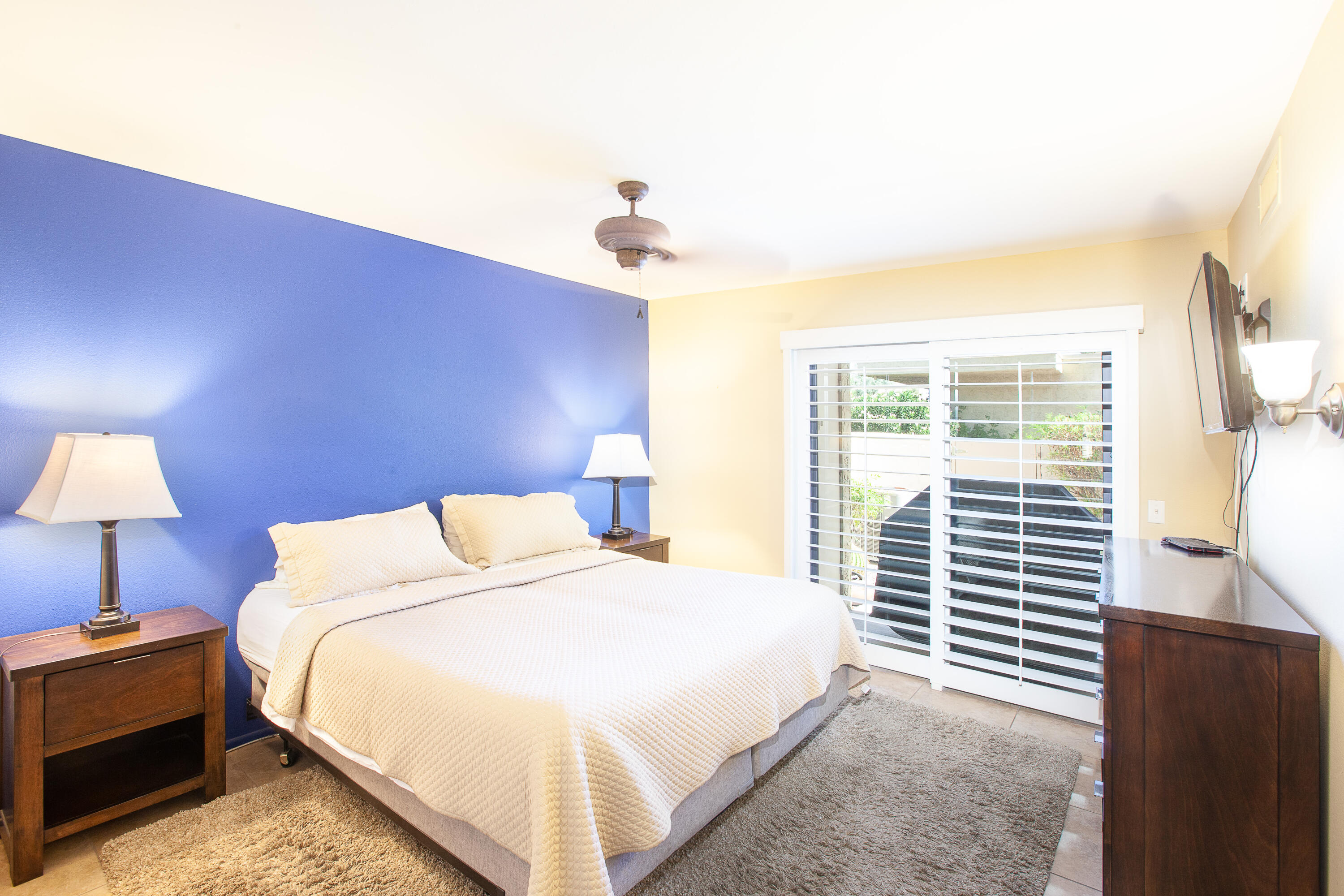 2348 Los Coyotes Drive Palm Springs, CA 92264 - Photo 6 of 15 a bedroom with a bed and a window