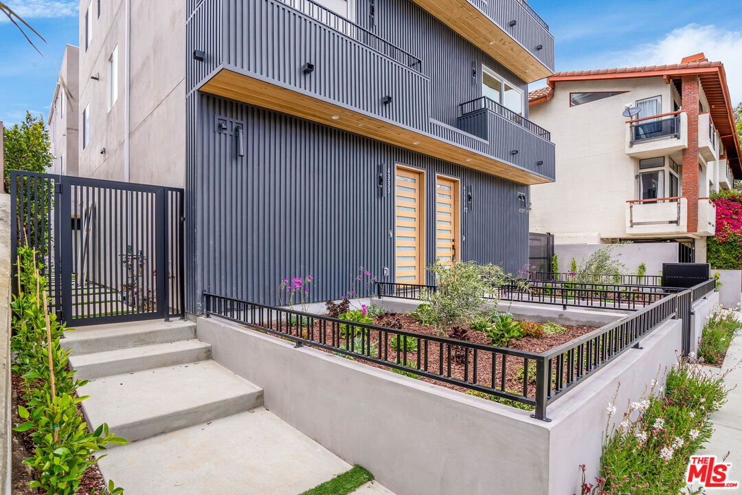4337 Dixie Canyon Avenue Sherman Oaks, CA 91423 - Photo 20 of 22 a view of balcony with two potted plants
