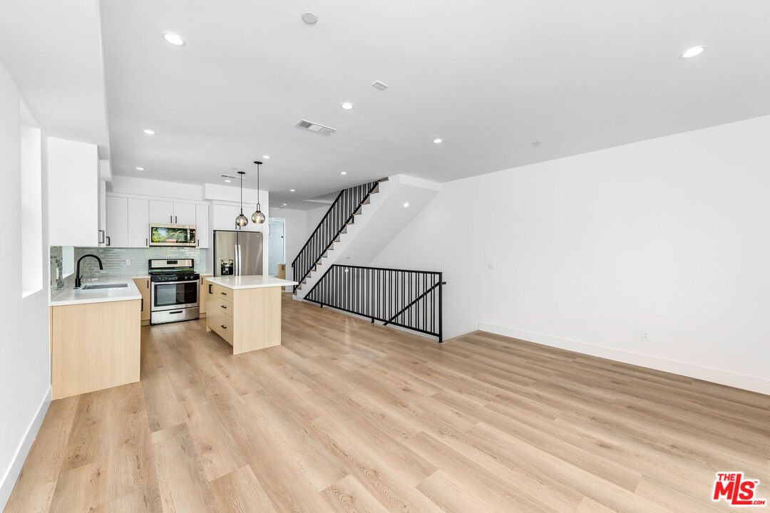 4337 Dixie Canyon Avenue Sherman Oaks, CA 91423 - Photo 2 of 22 a view of a kitchen with furniture and wooden floor