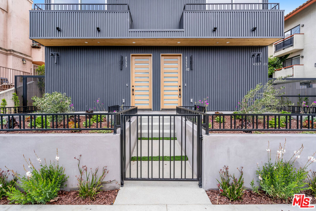 4337 Dixie Canyon Avenue Sherman Oaks, CA 91423 - Photo 21 of 22 a couple of flower plants in front of a building