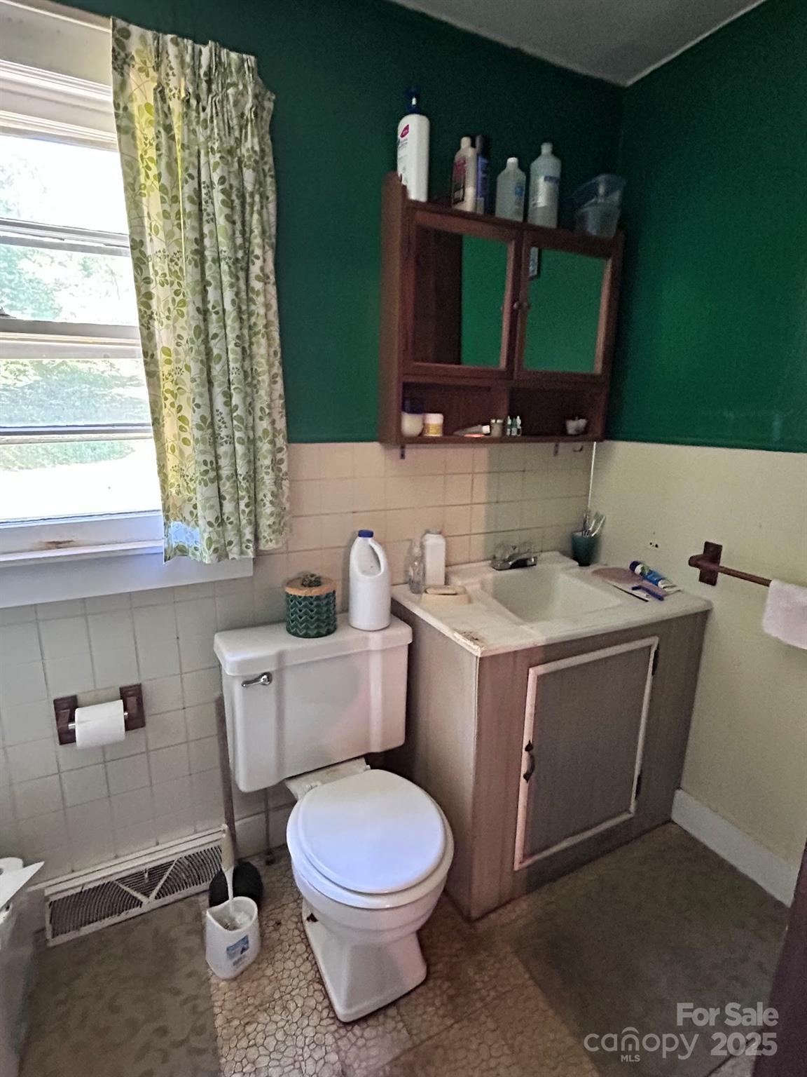 611 Johnson Hollow Road Bakersville, NC 28705 - Photo 12 of 43 a bathroom with a toilet sink and mirror