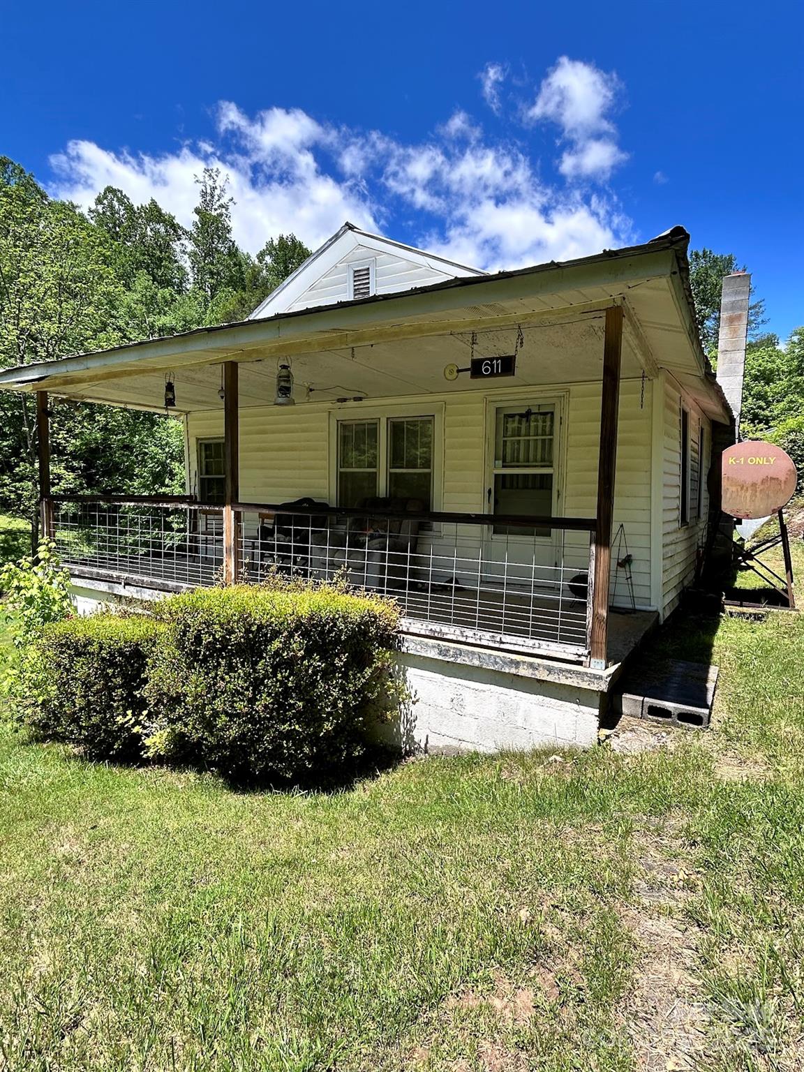 611 Johnson Hollow Road Bakersville, NC 28705 - Photo 3 of 43 a front view of a house with a yard