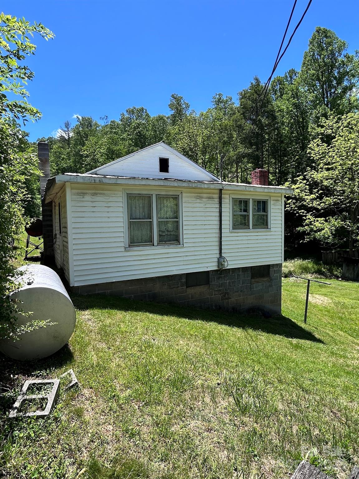 611 Johnson Hollow Road Bakersville, NC 28705 - Photo 4 of 43 a view of a house with a yard