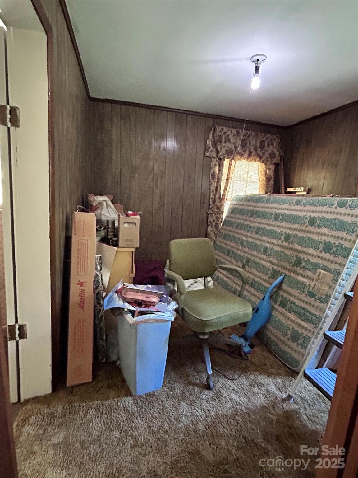 611 Johnson Hollow Road Bakersville, NC 28705 - Photo 6 of 43 a room with furniture and a window