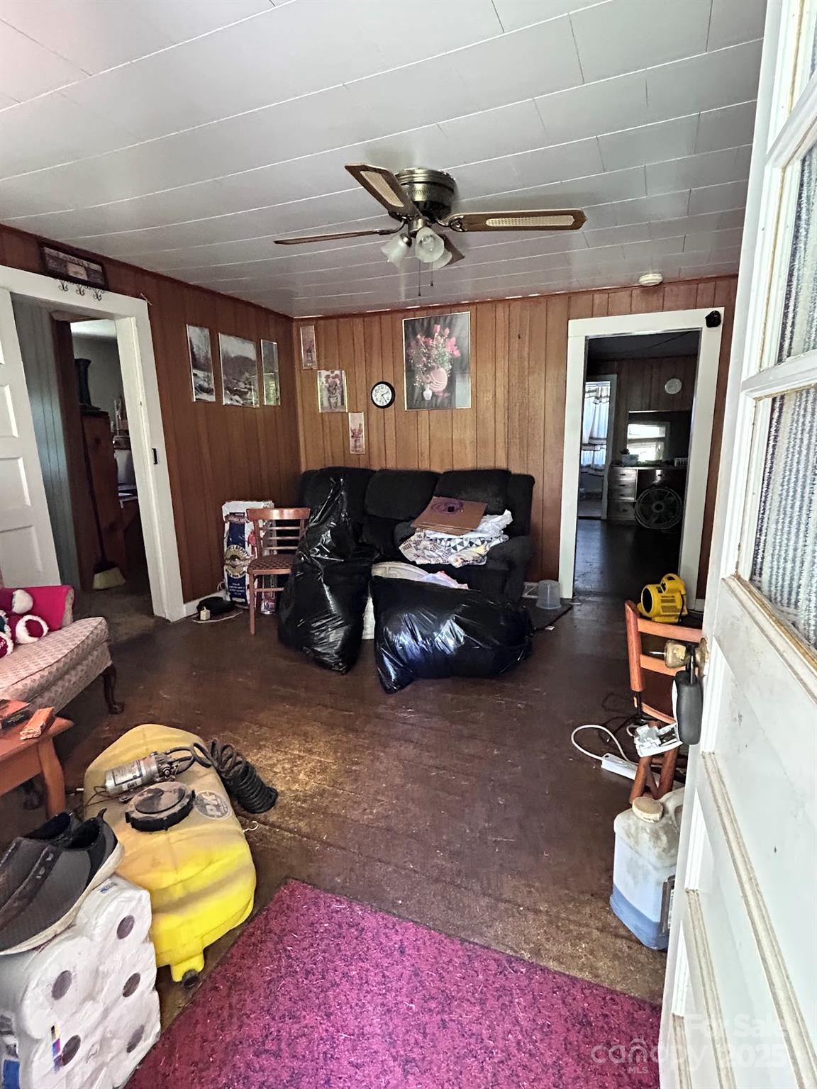 611 Johnson Hollow Road Bakersville, NC 28705 - Photo 7 of 43 a living room with furniture and a rug