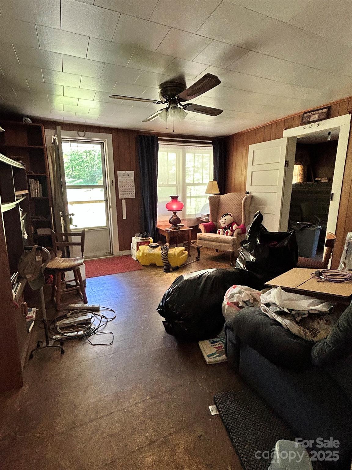 611 Johnson Hollow Road Bakersville, NC 28705 - Photo 9 of 43 a living room with furniture gym equipment and a large window